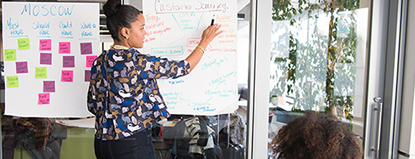 two women having a meeting inside glass panel office 1181615 600 banner