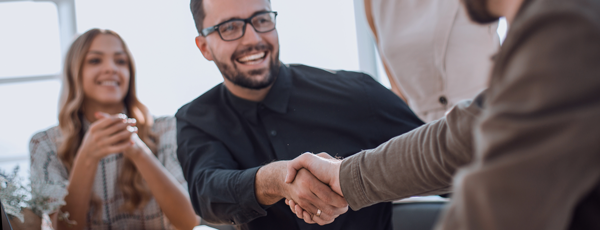 Office meeting handshake 600x230